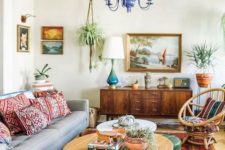 10 a boho meets mid-century modern living room with bright printed pillows, a rug and colorful furniture