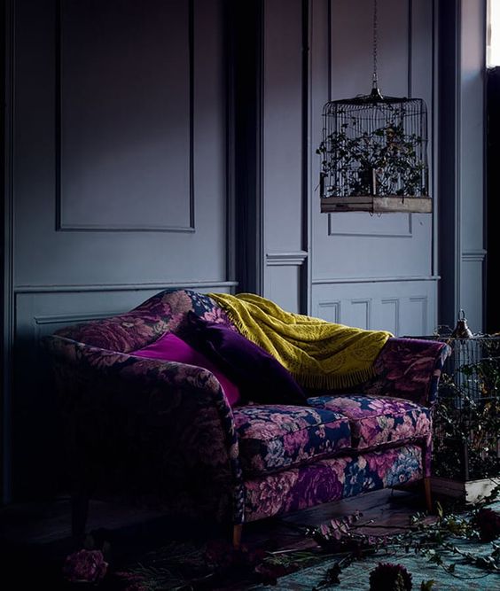 a colorful floral chair or sofa will add color and chic to your moody space and make it catchier