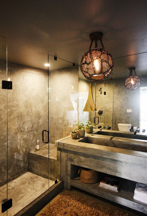 A stone and concrete bathroom with dim lights is a relaxation oasis   choose different lights