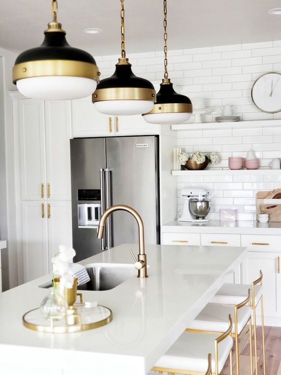 chic gold fxitures, gold touches on the lamps and gold stools to spruce up a neutral space
