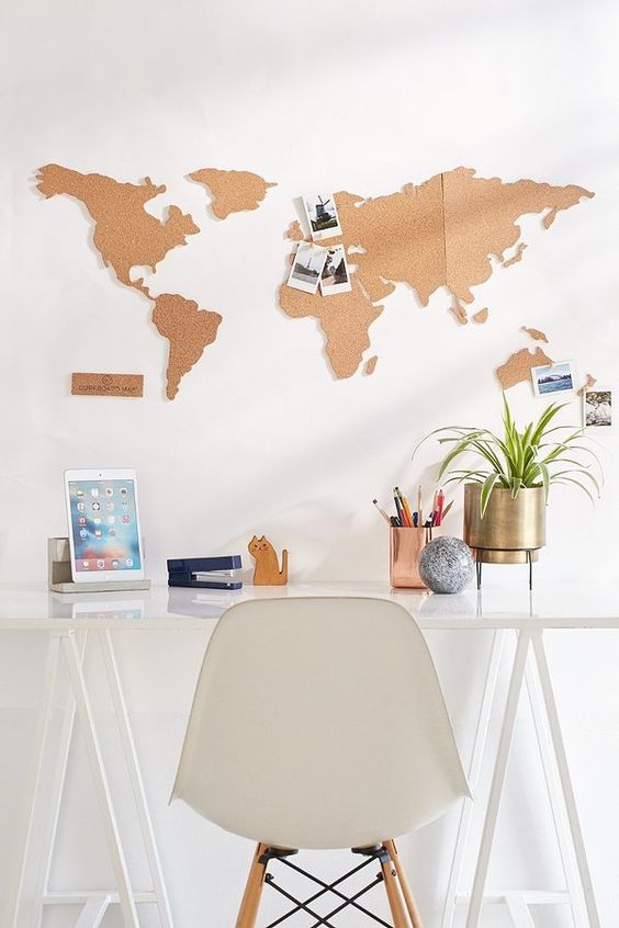 a cork board world map over the desk is a very fun and cool idea - a functional piece that doubles as decor