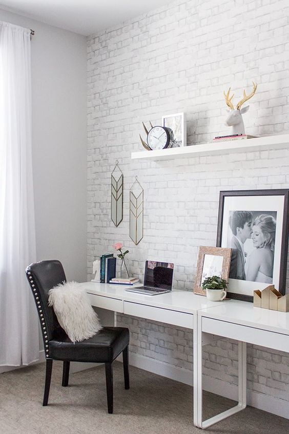 a boho meets mid-century modern home office nook is made catchier with white brick and artworks