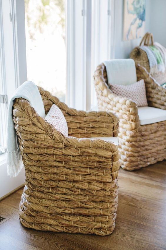 woven accent chairs are ideal for a contemporary coastal space, they bring an outdoor feel at once