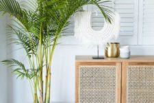 13 a cane console table is a cool idea for a coastal home, and cane is a hot home decor trend