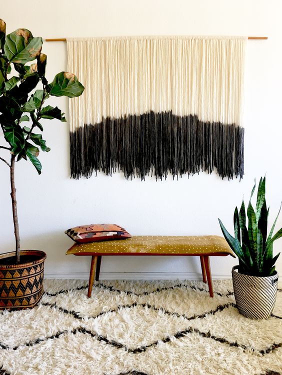 a long dyed fringe wall hanging in black and white is a calm boho decoration