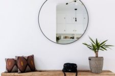13 a round mirror is a trendy decoration and a piece that doubles the light coming to the entryway
