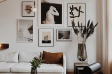 14 a monochromatic gallery wall for accenting a simple black and white space