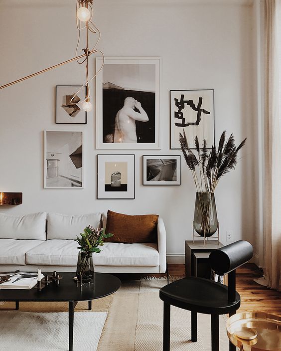a monochromatic gallery wall for accenting a simple black and white space