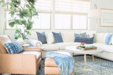 14 incorporate some comfortable leather and upholstered furniture into your coastal living room