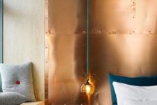 14 mixing cold and warm hues is a bodl idea, here a copper wall is paired with emerald bedding and grey pillows