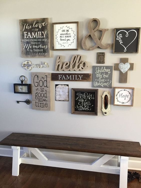 a rustic gallery wall with signs, artworks, a vitnage clock and key hints on the rustic vintage style in the rest of the house