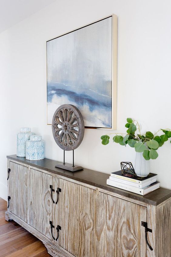 a very sleek plywood and wood console table for a contemporary coastal entryway