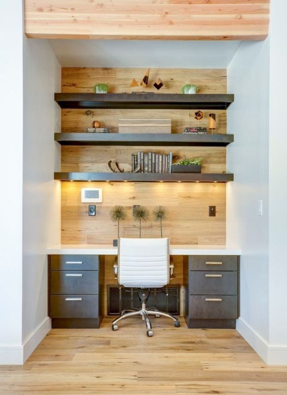 add more light to a home office nook attaching strip lighting to the shelves over your desk