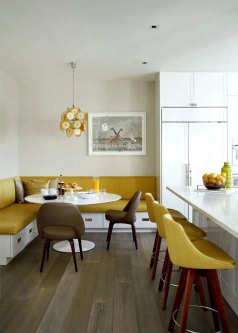 infuse your kitchen and dining space with color - go for mustard stools and an upholstered bench plus a chandelier