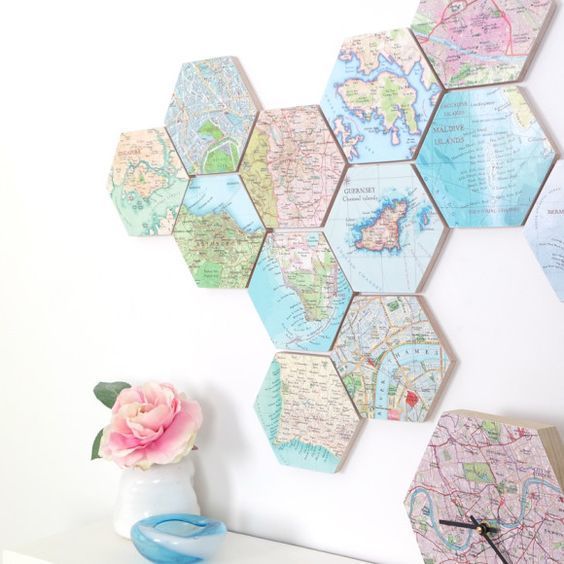 a world map of hexagon tiles that show the places where youve been and a city map clock to match