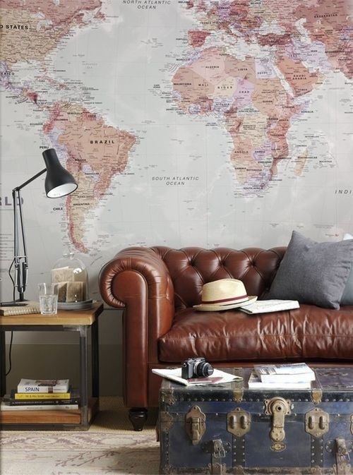 a large wall mural in a vintage meets boho living room is a beautiful and chic idea to try