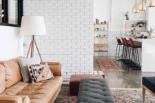 18 white brick walls in an open layout tie up the spaces and make the whole layout more cohesive