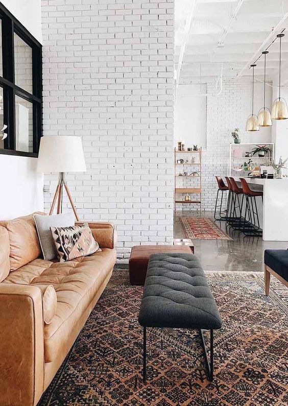 White brick walls in an open layout tie up the spaces and make the whole layout more cohesive