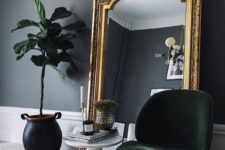 19 a chic moody nook with an oversized mirror in a gold frame – this mirror takes over the space and makes it wow