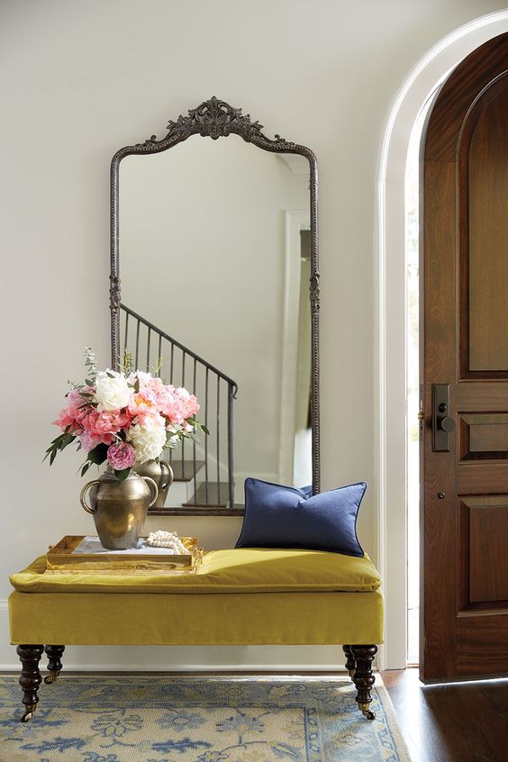 a mustard upholstered bench with storage space inside and on refined legs is a gorgeous idea for an entryway