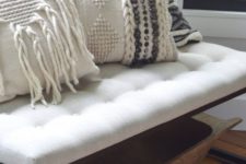 20 cozy macrame and braided pillows on an entryway bench will make your space very welcoming