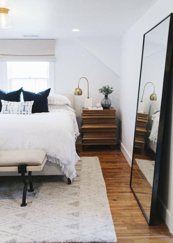 place a large mirror in your bedroom to double light and visually enlarge the space