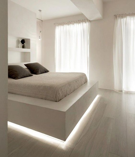 a floating bed highlighted with strip lighting is a chic contemporary idea and a cool way to add an edge to the bedroom