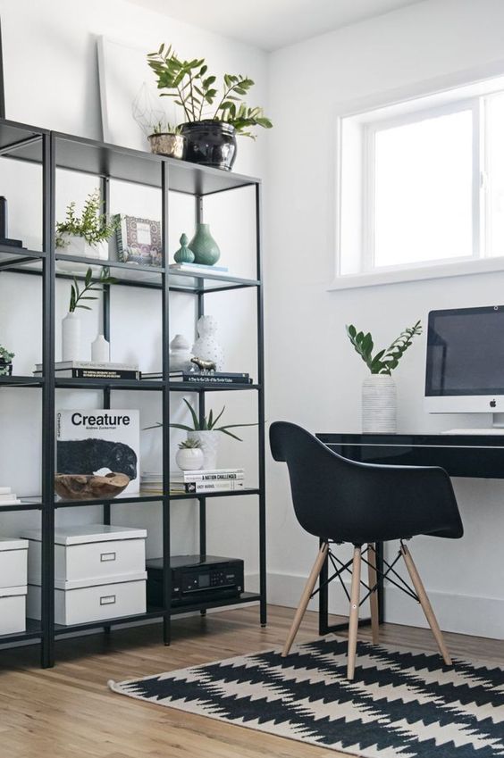 a laconic storage unit of blackened metal is a cool and trendy idea to store a lot of things