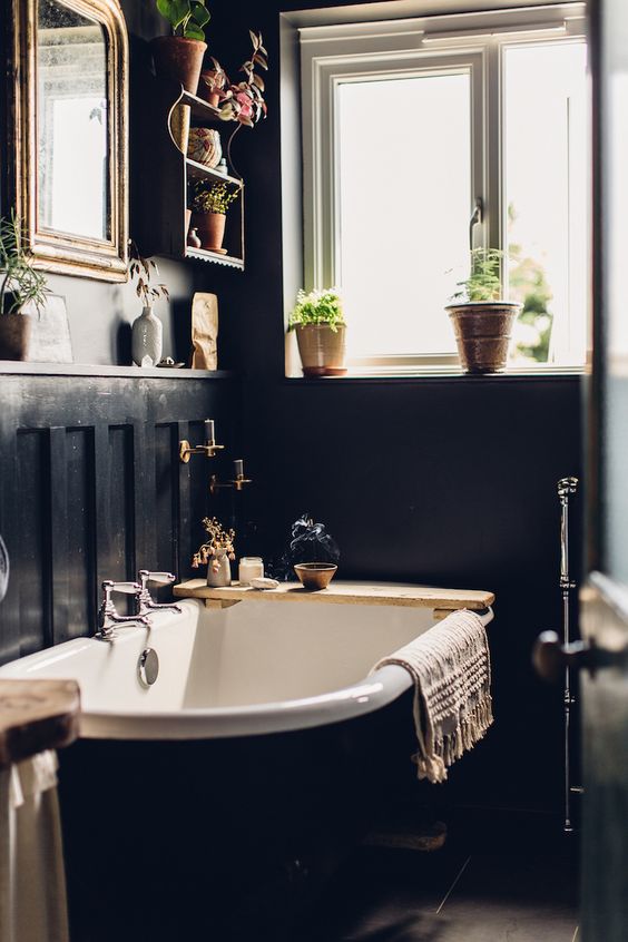 a mirror is a must for a bathroom, and it will also help you to fill your moody space with light