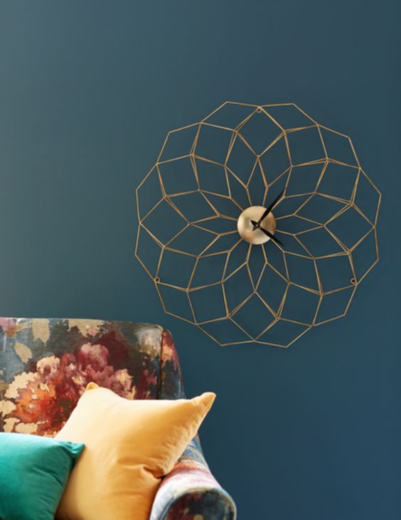 a stylish gold geometric clock is a subtle and chic wall decoration to rock in any room