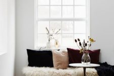 23 faux fur and velvet pillows of various shades make the space very cool and you won’t wan to leave it