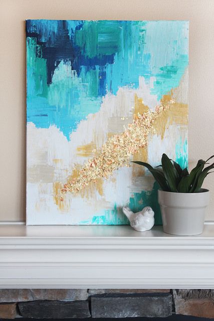 a bright artwork done with gold and gold glitter touches is a brigth idea to spruce up the space