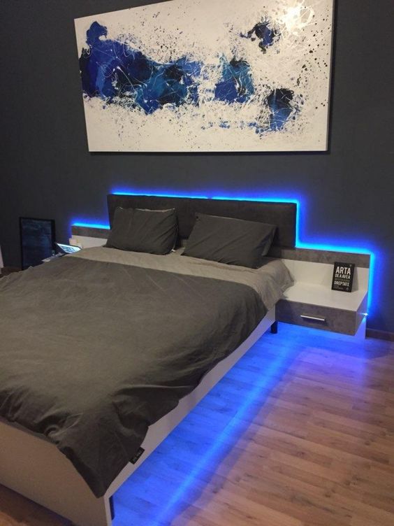 adding blue strip lighting along the bed abd under it will make your bedroom look ultra-modern and bold
