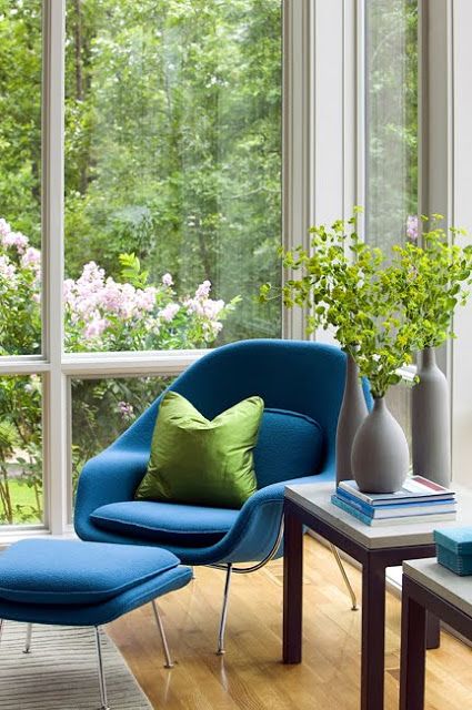 Tie up your nook with greenery outside   place some greenery in a vase and add a green pillow to match