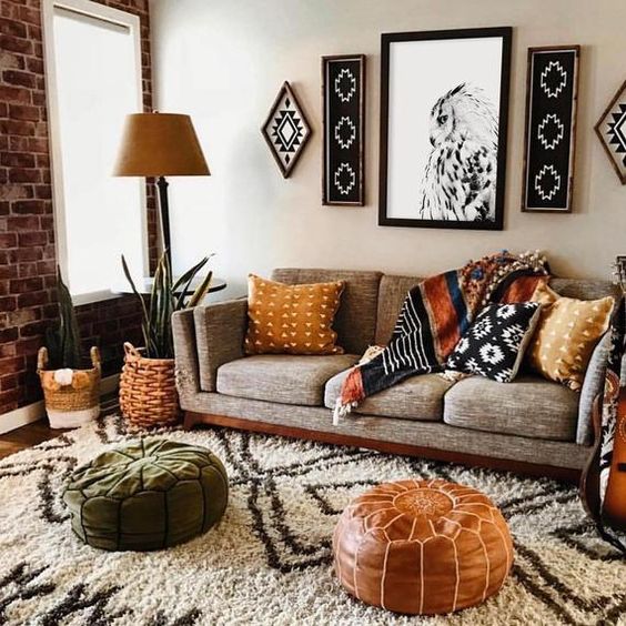 tribal artworks, a leather and suede Moroccan ottomans, woven planters and printed pillows to make the space free-spirited