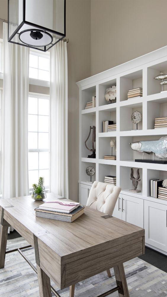 A free standing white shelving unit is a timeless idea for a home office, add some closed space to declutter the office