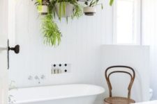 25 a ladder with hanging planters and much greenery for your own bathing oasis