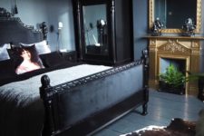 26 a dark moody bedroom with a couple of mirrors in heavy and carved frames for more light and more chic