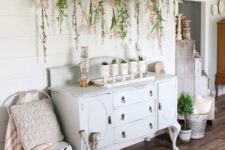 26 a vintage ladder with greenery and blooms plus potted plants make indoors feel like outdoors