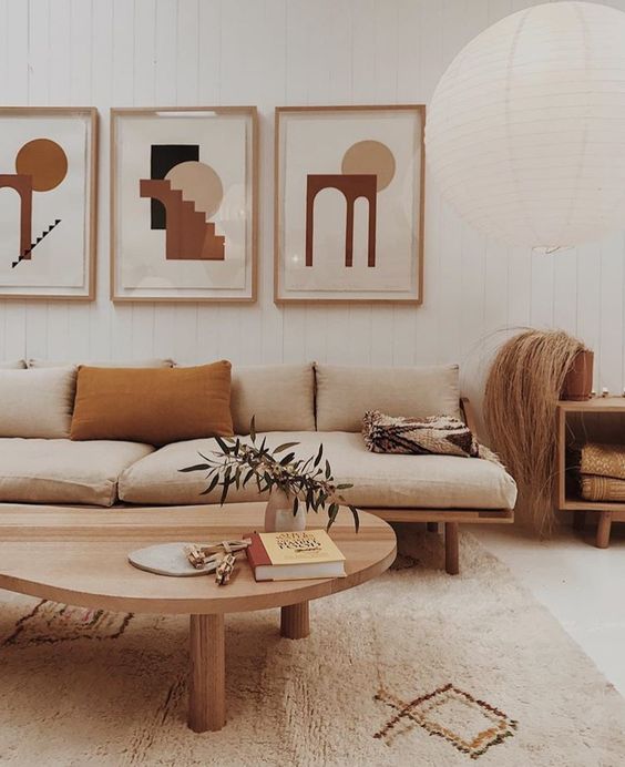 An analogous color scheme with neutrals, mustard and tan for a mid century modern living room