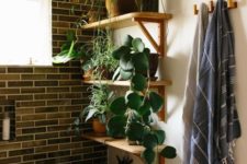 26 open shelving with potted greenery and some plants on the bathtub to feel like outdoors