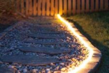 27 add lights to your garden pathways to enlighten the garden and make it more comfortable to walk at night