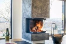 29 a modern fireplace like this one put in an open layout will make not one but two or more zones cozier