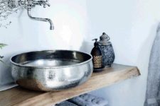 a beautiful hammered metal vessel sink will add a Moroccan feel to any bathroom, even the most casual one