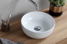 a classic small white vessel sink is a nice fit for a small powder room or a guest bathroom and will fit many styles