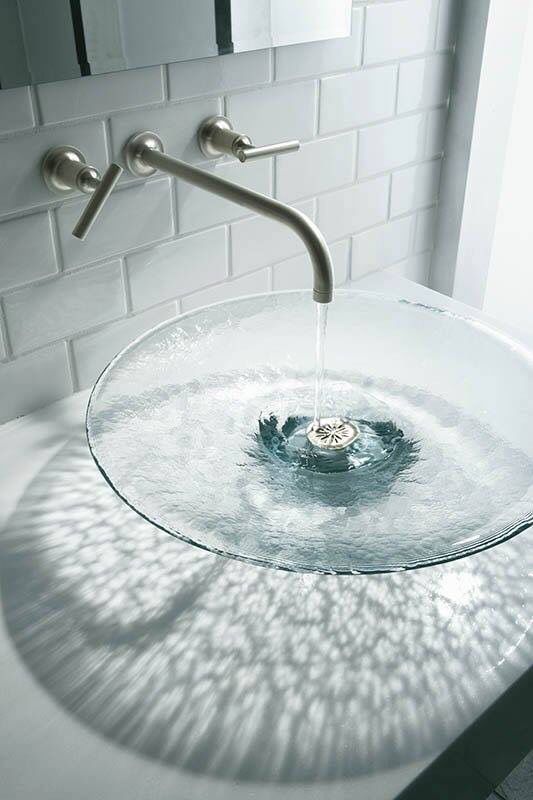 a large clear glass vessel sink will remind you of a water body adding a natural feel to the space