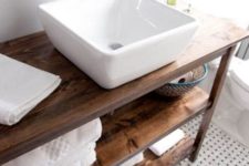 a large white square vessel sink immediately modernizes this rustic meets vintage bathroom