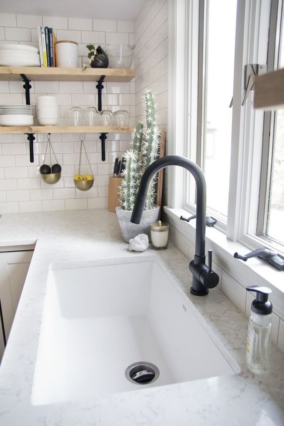 a white stone countertop plus a white rectangular undermount sink for a Scandinavian or minimalist kitchen
