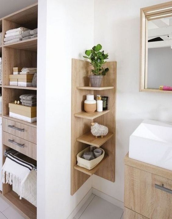 a comfortable wooden shelving unit with a base is ideal for a contemporary bathroom