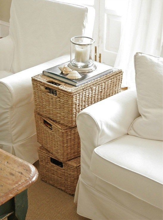 a stack of wicker baskets will work as a coffee table and as storage units, and it will match many spaces
